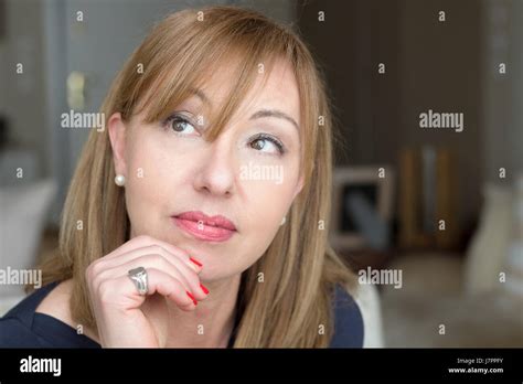 Portrait Of A Mature Woman 45 Years Old Thinking Looking Away Home