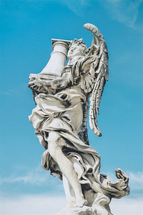 angel statue holding  column wallpaper wallpaperscom