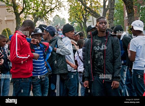 large group  young black youths hanging  streets  notting