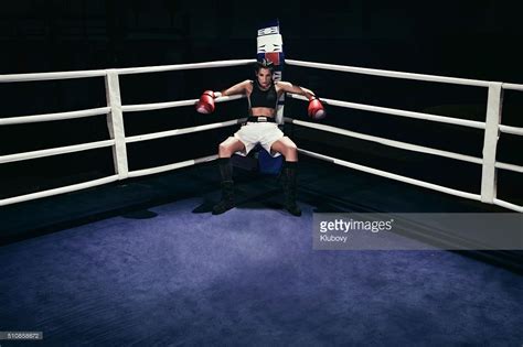 Photo Of A Female Boxer Sitting In A Boxing Ring Corner Female