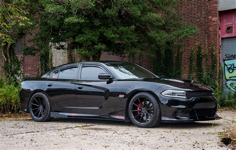 blacked  dodge charger  contrasting red calipers  accents caridcom gallery