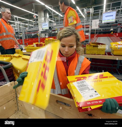 employees  german logistics group dhl sort mail   dhl hub  airport leipzighalle