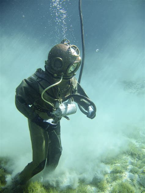 person  green scuba diving suit  stock photo