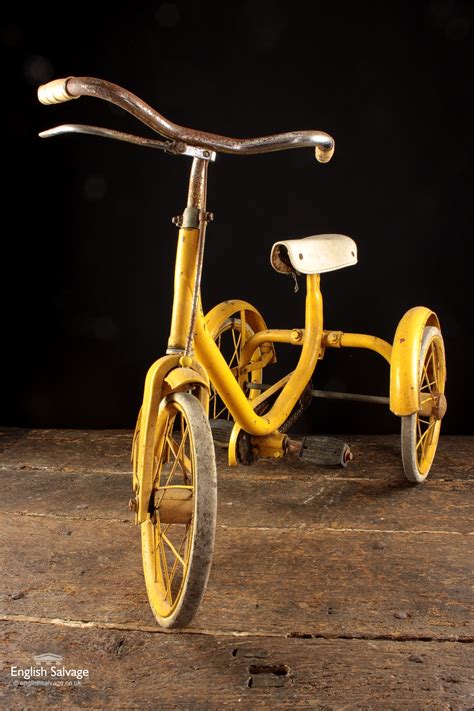 vintage yellow tricycle