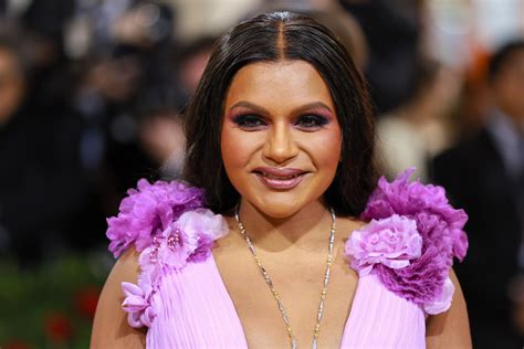 mindy kaling paired  plunging neckline   thigh high slit