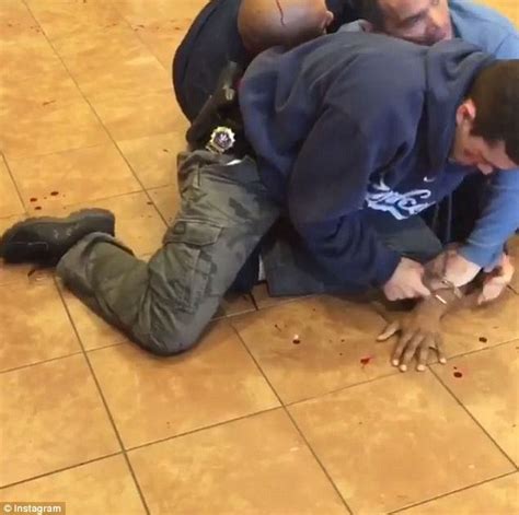 graphic video shows two nypd cops pinning down and punching a black man daily mail online