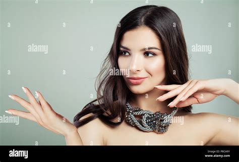 Perfect Brunette Woman Showing Emty Copy Space On Open Hand Presenting