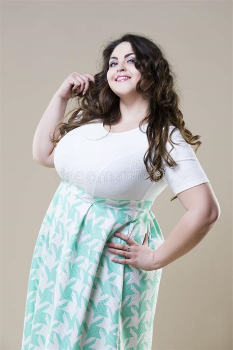 Happy Plus Size Fashion Model Fat Woman On Beige