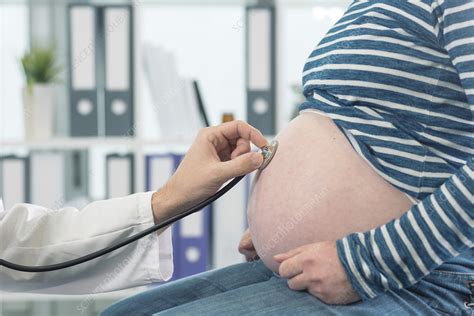 Doctor Examining Pregnant Woman Stock Image F021 2995 Science