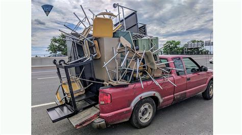 overloaded pickup full of furniture has police asking what could go