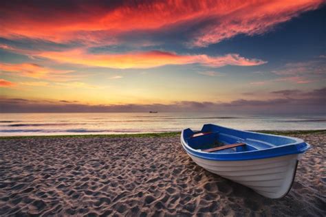 rowing boat beach sunrise wall mural wallpaper