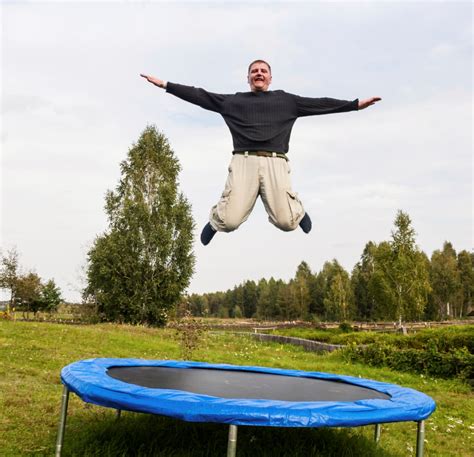 man jumping   trampoline management concepts perspectives