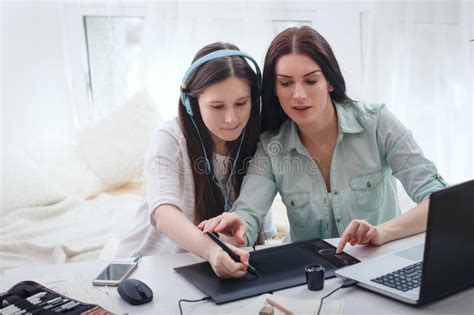 Mother Teaching Her Daugher To Draw By Stylus Stock Image Image Of