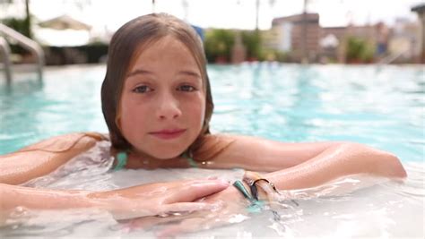 pre teen girl going underwater in the pool stock footage