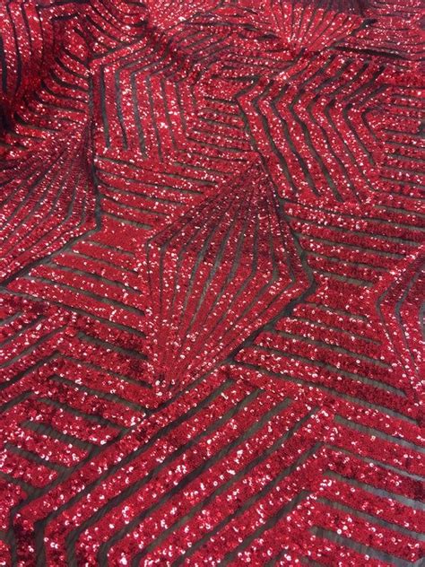 thea red geometric sequins diamond and stripes on black mesh