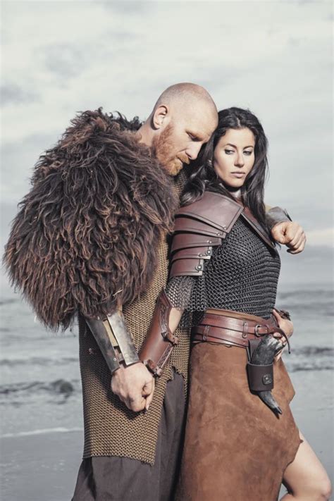 Dark Haired Viking Woman And Bald Viking Man In The Sea At Dusk