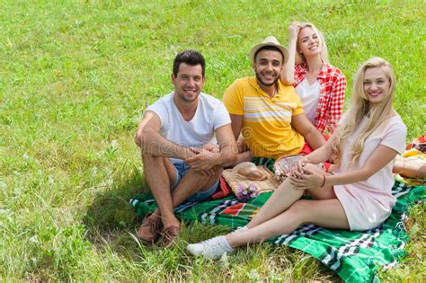 friends picnic people group sitting blanket outdoor green