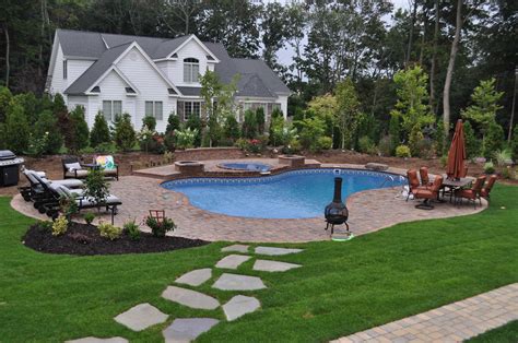 landscaped backyard design   form vinyl pool
