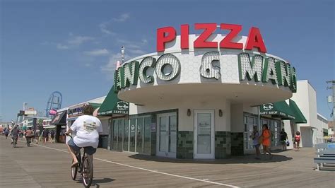 Manco And Manco Pizza On Ocean City Boardwalk Suspending Slices After