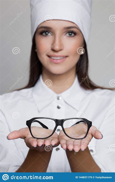 Close Up Portrait Of Woman Doctor Oculist Giving Glasses Stock Image