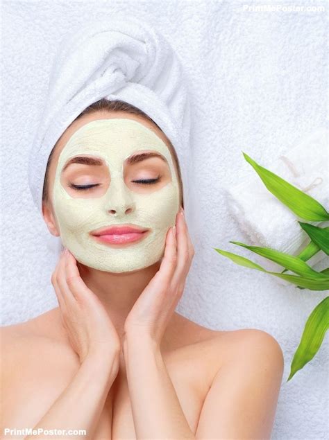 spa woman applying facial clay mask beauty treatments close
