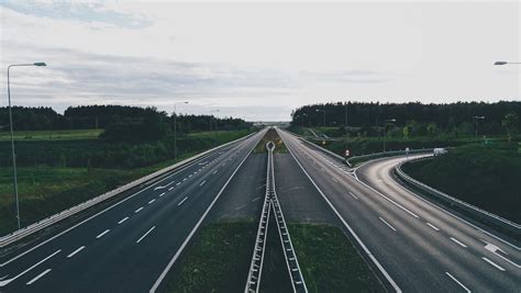 straight road  green fields  forest  stock photo