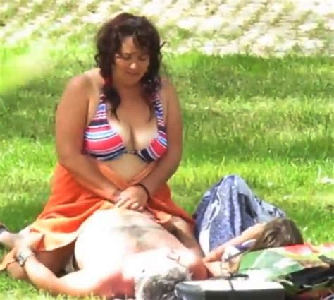 couple caught having sex in the middle of a park right