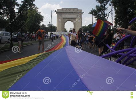 gay and lesbians walk in the gay pride parade editorial