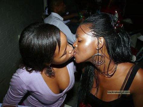 wife kissing girl at party