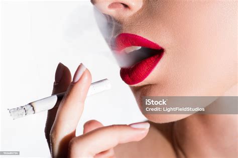 Cropped Image Of Woman Smoking Cigarette And Exhaling Smoke Isolated On