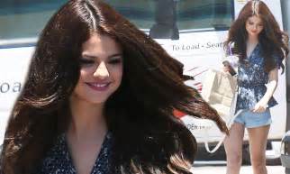 selena gomez puts her luxurious locks and long legs on display after