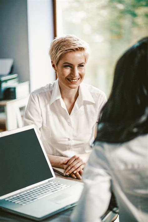 blonde woman  interviewed  office stock photo image  business email