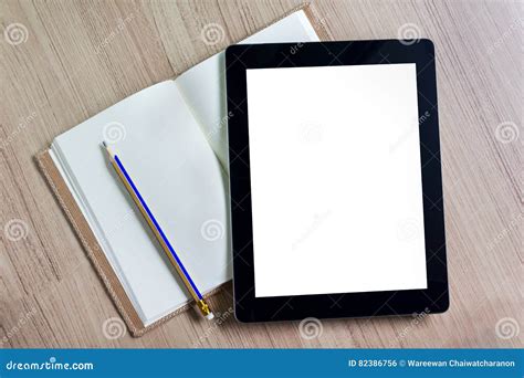 blank screen tablet  blank page diary  pencil  wooden fl stock