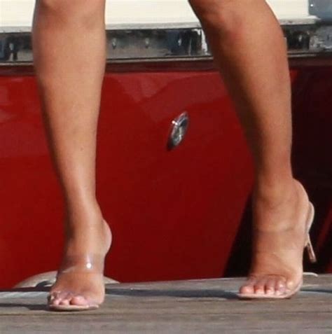 glam beyonce goes boating in see through perspex heels at