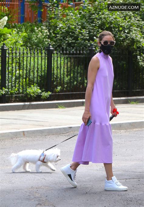 olivia palermo dressed in a summer dress and a protective