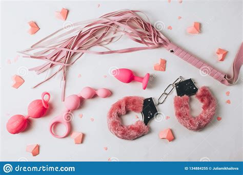 Various Pink Sex Toys Are Arranged On A White Background Stock Image