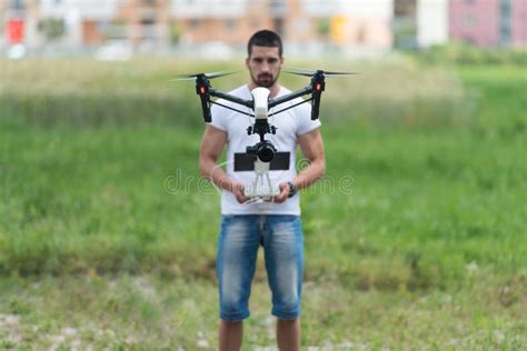 man operating  flying drone   sky stock photo image  person aerial