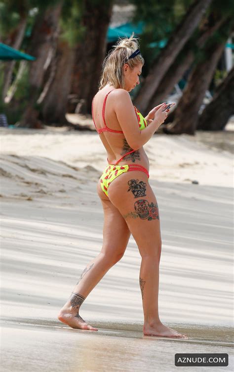 olivia buckland displays her tattooed body in barbados with alex bowen