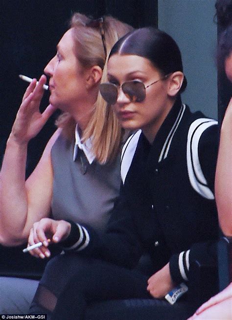 Bella Hadid Smokes A Cheeky Cigarette On A Curb In Nyc Daily Mail Online