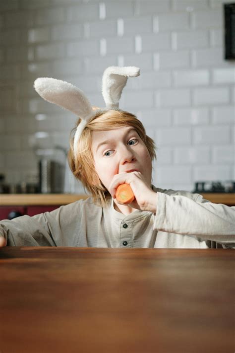 boy eating carrot  stock photo