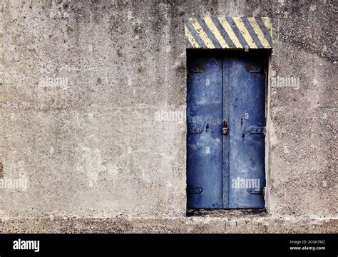 mysterious blue padlocked reinforced steel door   concrete nuclear bunker underground bomb