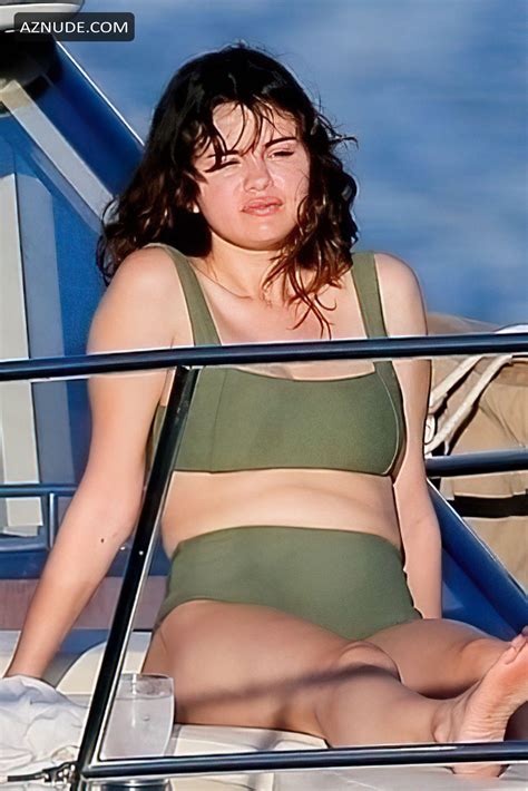 selena gomez stuns as she soaks up the sun in green bikini aboard