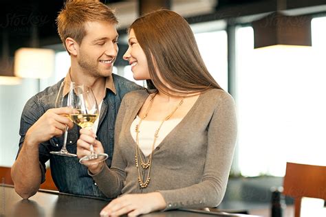 Couple In Love Drinking White Wine Stocksy United