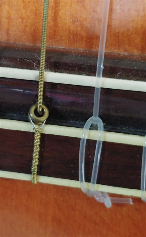 installing ball  nylon strings   classical guitar