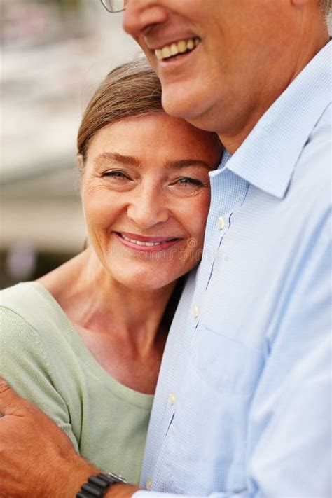 Cute Mature Woman Being Hugged By Her Husband Stock Image Image Of