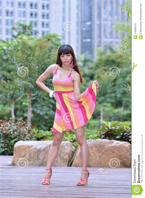 Beautiful And Sex Asian Girl Shows Her Youth In The Park Stock Image