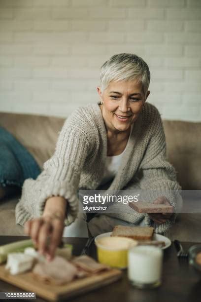 Older Woman Eating Sandwich Photos Et Images De Collection Getty Images