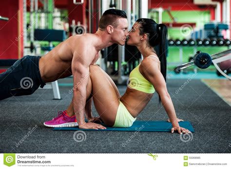 Fitness Couple Workout Fit Mann And Woman Train In Gym