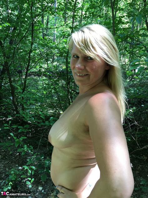 fatty mature susi spreading naked big ass while romping nude in the woods