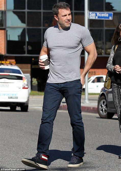 ben affleck displays his muscular physique in a tight grey